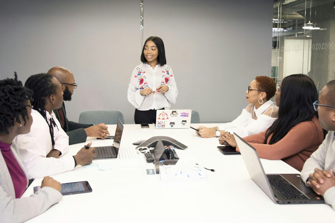 woman presenting in business meeting