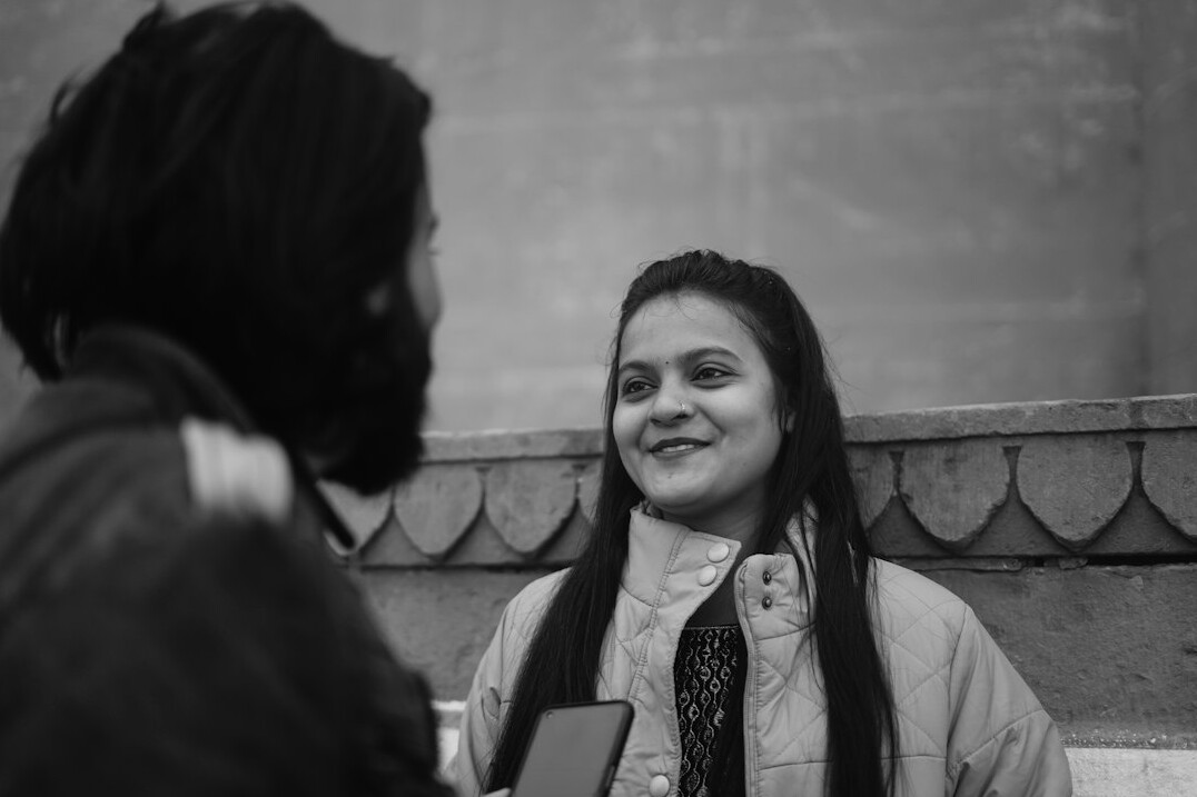 person smiling during conversation