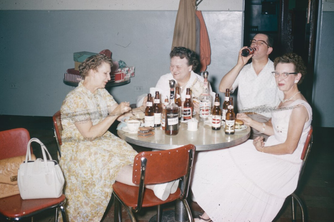People in a discussion around a conference table