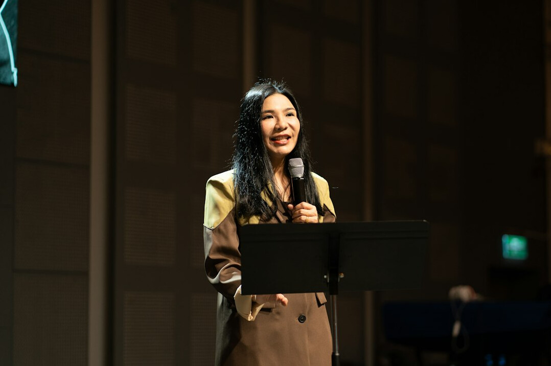 confident public speaker on stage